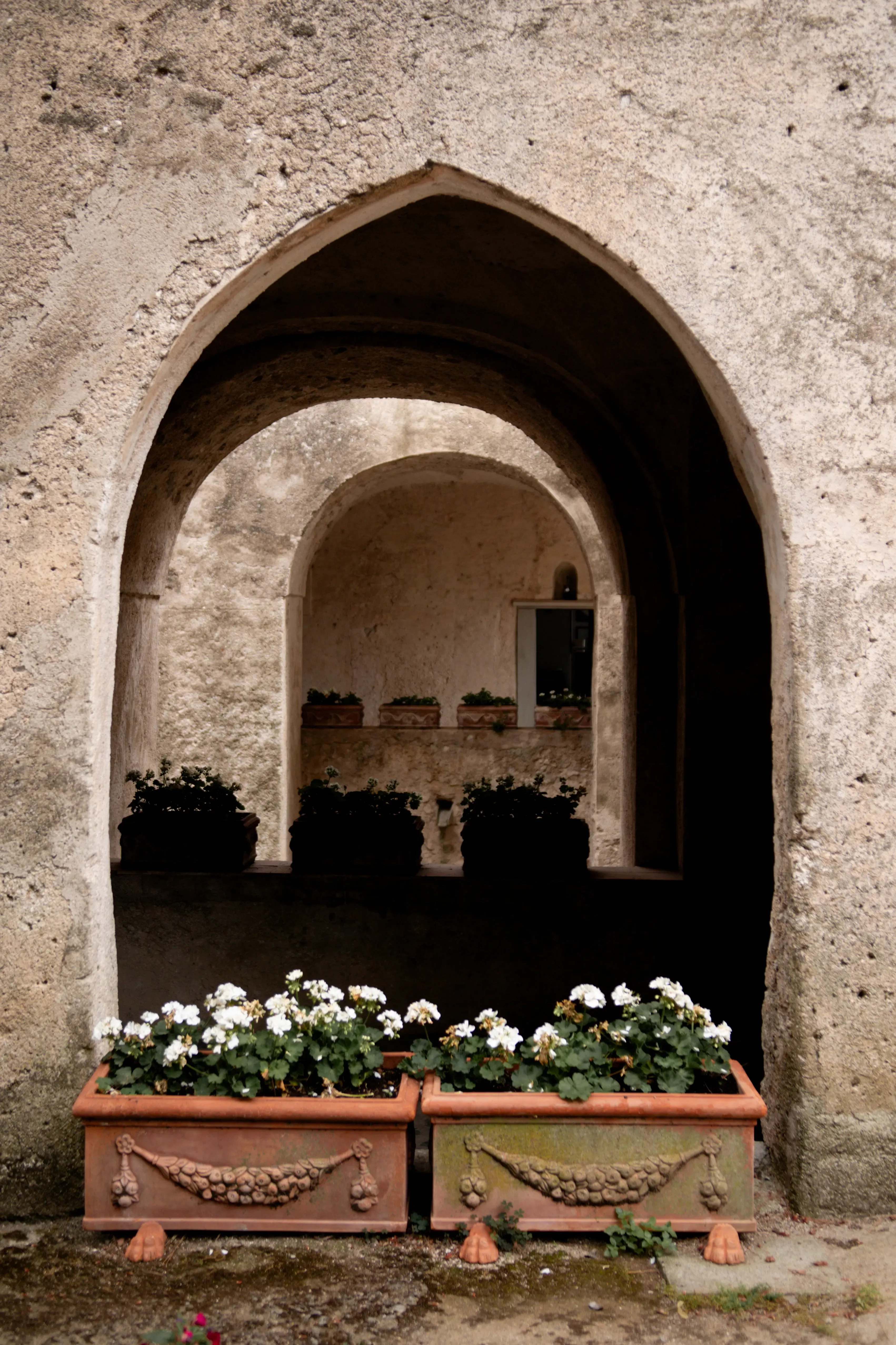 beautiful clay window with flower pots at the window sill